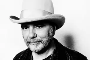 Portrait photograph of musician Daniel Lanois in black and white