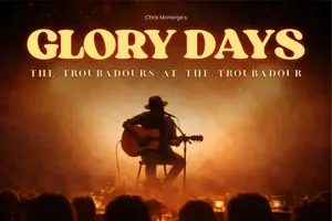 A folk singer sits on a dimly lit stage playing an acoustic guitar with a decorative ember gradient background and title that reads "Glory Days, the Troubadours at the Troubadour"